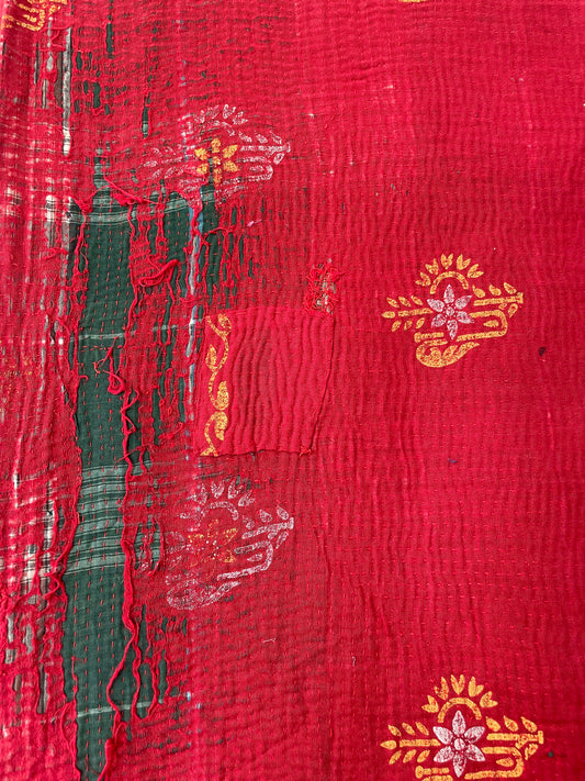 Red fabric with gold and white patterns