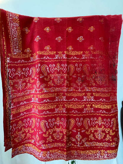 Red fabric with gold and white patterns vintage kantha bed throw