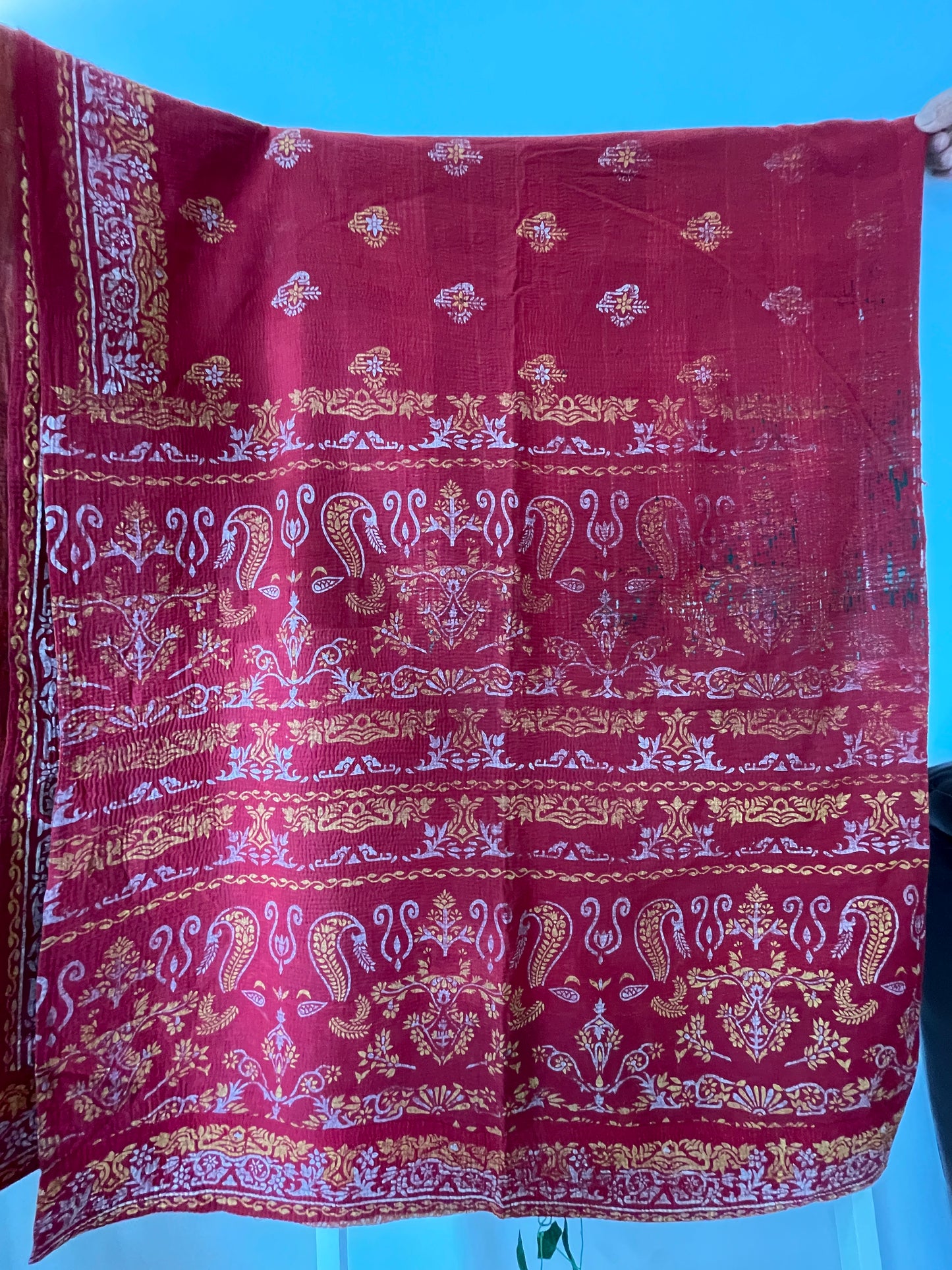Red fabric with gold and white patterns vintage kantha bed throw